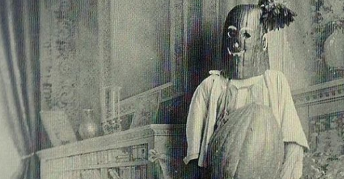A person in a ghost costume